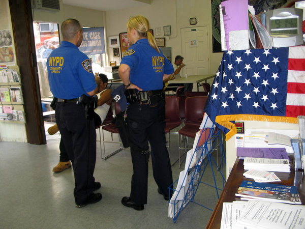 Cops checking in at El Centro, a Hispanic community center - Photo: Cristina DC Pastor
