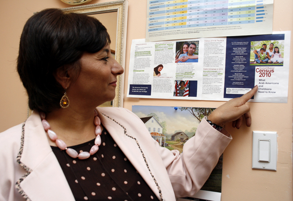 Maha Attieh Points to a Census Poster in her Office - Photo: Sarah Kate Kramer