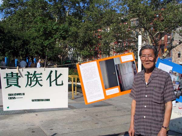 A senior tenant in Chinatown at a street exhibition of gentrification in the neighborhood held by grassroots organizations in 2005
