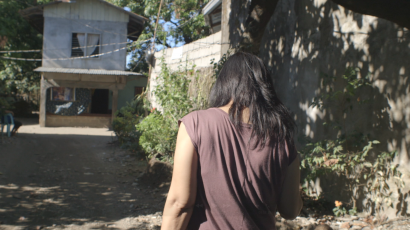 Film still from Documented - Emily Salinas walking to her house. (Photo: APO Productions) 